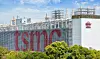 A Tsmc manufacturing plant in Taichung, Taiwan, stands behind greenery in Central Taiwan Science Park ('CTSP)
